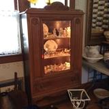 Lighted Cabinet full of miniature kitchen items.