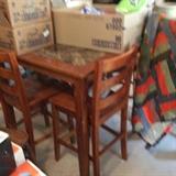 High table with granite center & 4 tall chairs