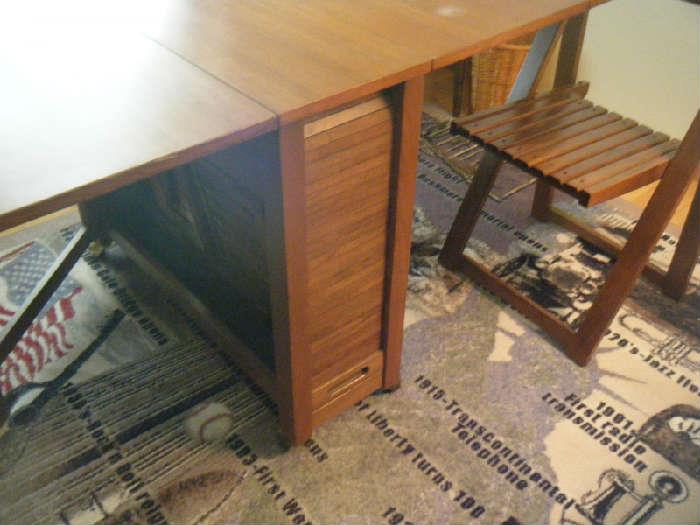 Mid Century Modern Romanian gate leg table with stored slat chair
