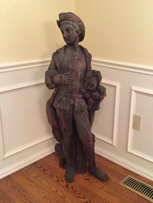 Life-size carved wooden French figure.