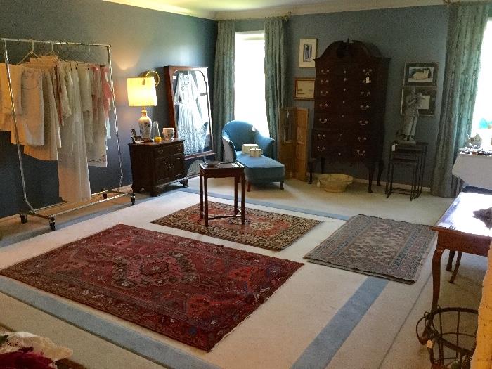 bedroom, fine linens, large collection of oriental rugs.