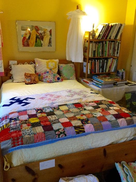 Quilts, watercolors, and many large coffee table designer books.