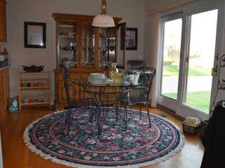 Round Rug, Glass Table and Two Chairs, China Cabinet. China Dishes, Mercury Glass Vase, Shelf, Art