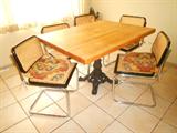 Butcher block table w/iron base. 6 Bruer style chairs...