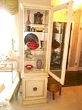 Curio cabinet is filled with beautiful pieces