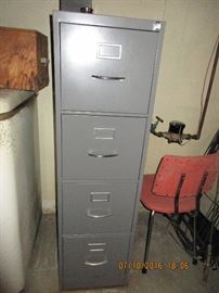 Metal four drawer file cabinet with key
