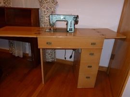 Vintage Montgomery Ward sewing machine and cabinet