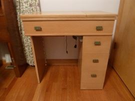 Vintage Montgomery Ward sewing machine and cabinet