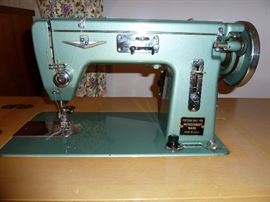 Vintage Montgomery Ward sewing machine and cabinet