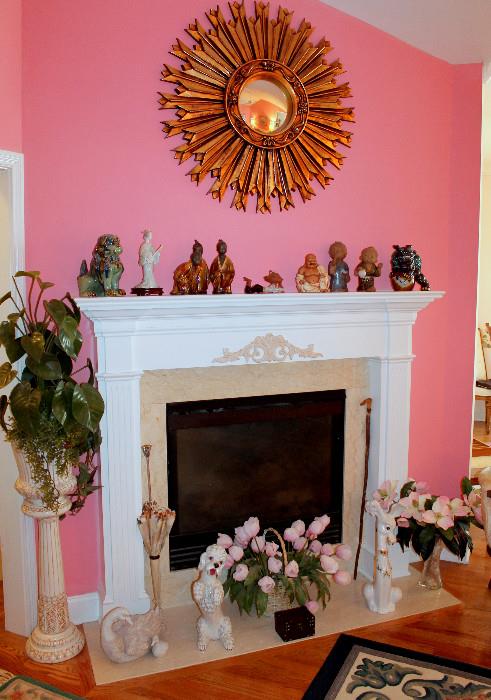 Sunburst mirror, Asian figurines, and other home decor