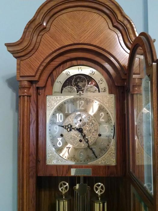 Three-chime wind-up Baldwin grandfather clock with moon dial and silence feature.
