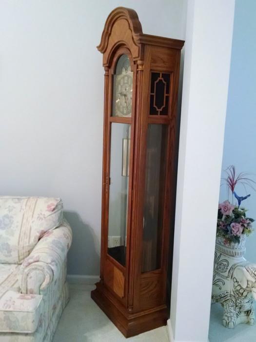 Three-chime wind-up Baldwin grandfather clock with moon dial and silence feature.
