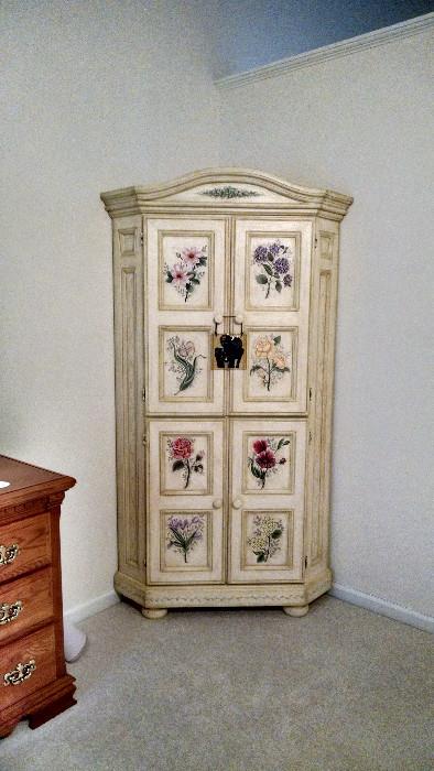 Cream/white corner cabinet with floral designs