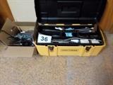 Craftsman tool box filled with gun cleaning supplies and a GE CB 