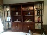 This large wall display cabinet and the items on and around this cabinet are for sale. 
