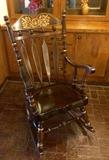 Beautiful vintage rocking chair with gold accents. Comfortable and sturdy  