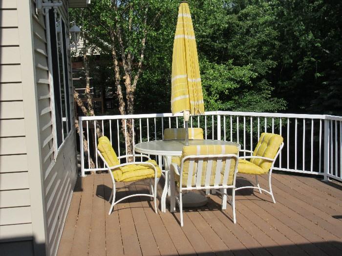 PATIO TABLE WITH 4 CHAIRS AND YELLOW UMBRELLA