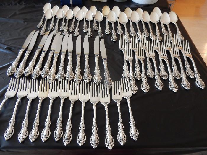 Wallace sterling flatware service or 12, grand Victorian pattern.  12 knives, soup spoons, teaspoons, dinner forks and salad forks.