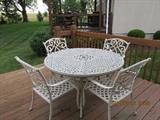Wrought iron patio set with weather protection