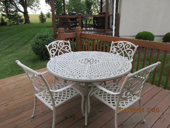 Wrought iron patio set with weather protection