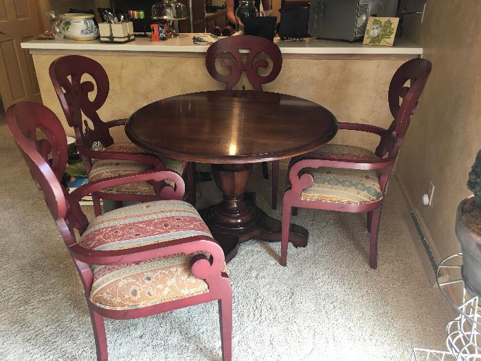 Toms-Price French Empire Center table and 4 Watkins arm chairs in a roasted pepper finish.