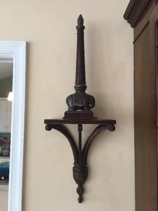 Pair of elephant obelisks on matching wall sconces