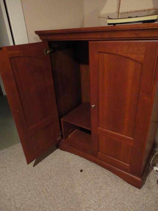 Entertainment center with double doors.  Fits 40+" sized TV.  Includes bottom shelving to store cable box or media boxes.