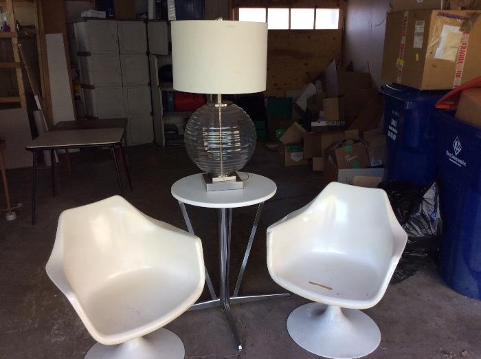 Burke lounge chairs, chrome and vinyl side table, glass lamp