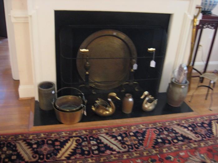 Collection of crocks, brass, and large Middle Eastern tray.  Edge of 9X12 Oriental carpet.