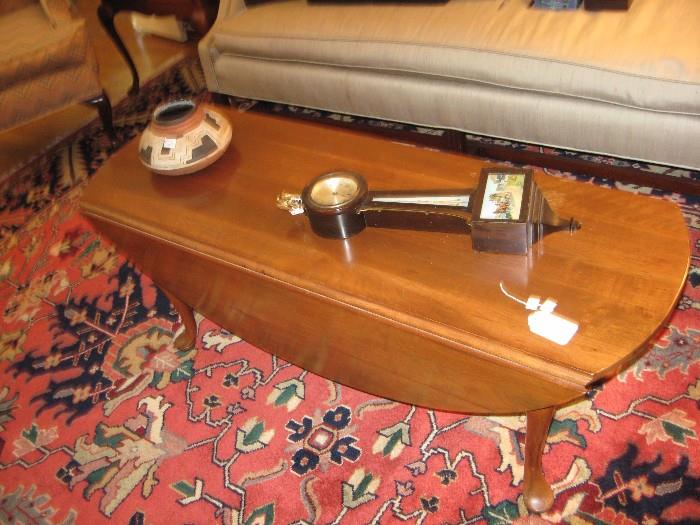 Suter's coffee table, banjo clock and Indian bowl.  Indian Heriz Oriental carpet 9X12.