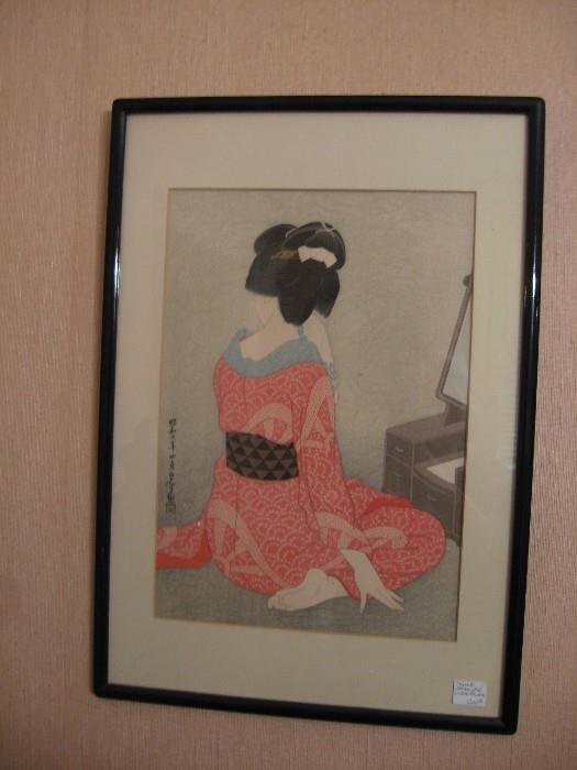 Japanese woodblock print of woman in orange kimono