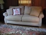 Broyhill sofa with cream upholstery;  good condition and contemporary.  Carpet is Romanian; Heriz pattern.