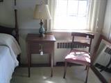 Suter's side chair with needlepoint seat and Hepplewhite two-drawer side table, & lamp.