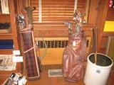 Kerrigan gold clubs and "The Babe" clubs in leather bag, large crock and wood shaft golf clubs