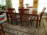 Beautiful solid wood dining room /kitchen table and 6 chairs including two armed