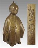 146) Chinese Bronze Figure of a Child: Signed as shown. 11 ½”h, weight 9 lbs.