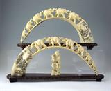 2 CARVED IVORY ELEPHANT BRIDGES EACH CARVED FROM A SINGLE TUSK, 7 CARVED FROM A SINGLE TUSK, 7 CARVED ELEPHANTS ON EACH ONE.