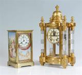 Lot 1:  A. D. MOUGIN PORCELAIN FRENCH CRYSTAL REGULATOR CLOCK: Brass case with artist signed hand painted porcelain inserts on each side and front. Beveled glass panel remains on front door as well. Each plaque signed Bluse. Porcelain dial with Roman numerals and floral garland. A. D. Mougin time and strike movement. Engraved dedication inside case. Key and pendulum in office. 10 1/4'' h. x 6'' x 5 1/2''.
CONDITION: Wear to finish on case, currently running but not guaranteed to continue.

Lot 10:  ANSONIA ''UTOPIA'' CUT GLASS CRYSTAL REGULATOR CLOCK: Gilt brass case with architectural finial, bow front and back, 4 pillars with cut glass pillars. Enamel dial with Roman numerals, open escapement, eight day time and strike moment. Faux mercury pendulum and key in office. 17'' h. x 9'' x 6 1/4''. Est. $2500/3500**
CONDITION: Scratches primarily interior of case, currently running however not guaranteed to continue.