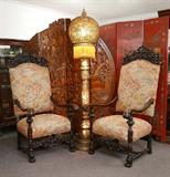 Lot 17: Reticulated Syrian Floor Lamp, Glass Fringed Shade: Illuminated base and shade 6'8"h.
Lot 21:  PAIR RICHLY CARVED ITALIAN THRONE TYPE CHAIRS: Carved and pierced foliate and shell motif top rail, shaped arms. Carved arm supports and front stretcher, turned stretchers, front scroll feet. Floral upholstery. 56 1/2'' h. x 29 1/2'' x 30''.
CONDITION: Several old repairs, age splits, other wear consistent with age and use.