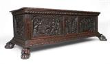Lot 9:  17TH CENTURY CARVED ITALIAN COFFER: Single board top with carved trim, sides and front profusely carved with figures, mythological creatures and crest with crown. On 4 paw feet. 22 1/2'' h. x 69 1/2'' x 27''.
CONDITION: Missing on piece of trim, other wear consistent with considerable age and use.
