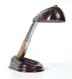 Lot 147:  JUMO BREVETE FRENCH MODERNIST FOLDING DESK LAMP: Design by Gustave Miklos Ca. 1940. Manufactured in Bakelite (phenolic plastic), copper and steel. Extended measures 20'' x 10 3/4'' x 7 1/4''. Est. $1500/2500**