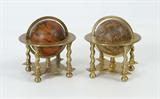 Lot 4: PAIR CORONELLI BRASS MOUNTED TABLE GLOBES: Terrestrial and Celestial globes, each printed and hand colored, terrestrial globe dated 1697 and marked Coronelli. Each globe 3 1/4'' dia., mounted in brass stand with month, date and signs of the Zodiac. Actual age is unknown. Overall in 5 3/4'' h. x 5 1/8'' dia.
CONDITION: Toning to both, celestial globe complete but with tears.