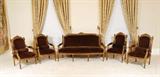 Lot 67: LOUIS XVI STYLE GILT WOOD PARLOR SET: Comprising a petite sofa and 4 armchairs. Each profusely carved with floral and foliate motifs, tacked burgundy upholstery. Sofa measures 42 3/4'' h. x 72'' x 26 1/2'', chairs 42'' h. x 26'' x 26''.
CONDITION: Multiple chips to gilt on each piece.