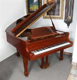 Lot 94: SAMICK SG-155 MAHOGANY BABY GRAND PIANO: High gloss mahogany case model SG-155, serial number INDG0177. Measures 40 1/2'' h. x 62'' x 57 1/2''. Sold with matching leather top stool 19 1/4'' x 30'' x 14''.
CONDITION: Missing one rubber stopper on top, several other small blemishes to finish. As with all pianos will require tuning after moving. While it might be fine, we cannot guarantee the soundboard.