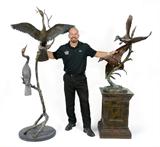 Lot 1309:  SMITH, Geoffrey L., (American, 20th/21st Century): Life Size Cormorants, Bronze with Patina, 8' tall, signed and #'d 7/48, affixed to a polished beveled marble plinth that is approximately 23'' in diameter. Est. $3000/5000**.Lot 1310:  SMITH, Geoffrey L., (American, 20th/21st Century): Mallards in Flight, Patinated Bronze, 48'' h., approximately 24'' w., base is bronze with patina, base is a beveled bronze with incised signature, dated '95, #'d 35/48. Est. $2000/4000**