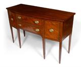Lot 1017:  NEW ENGLAND HEPPLEWHITE SIDEBOARD, CIRCA 1780: Bowfront with rope twist inlay along edge of single board top. 2 central drawers with 2 side doors, right side with interior drawer. Arched center with tapered legs. Replacement brass pulls. 37 1/4'' h. x 58'' x 22 3/4''.
CONDITION: Age splits to top, other wear consistent with age and use.