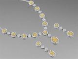 Lot 1051:
MAGNIFICENT FANCY YELLOW AND WHITE DIAMOND NECKLACE AND EARRINGS: 18k white gold demi parure of necklace and earrings. NECKLACE: 34.19 Ctw of round brilliant and square brilliant princess cut diamonds, from VS1-I1 in clarity and H-M and Fancy yellow in color. The chain is a double line of diamonds. Length 19'' The pendant drops 1 3/4'' from the necklace. EARRING: 16.82 Ctw of round and square brilliant princess cut diamonds from H-M and Fancy yellow, VS1-I1 clarity. Length 2 1/2''. Post and nut closure. TOTAL diamond weight in the set: 51.01 Ct. Total weight 123.3 grams. Sold with 2 current Florida Diamond Appraisers GIA graduates appraisals totaling $170,000. Est. $80000/168000**