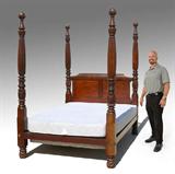 Lot 1081:  MID 19TH C CARVED 4 POSTER BED: Carved acanthus leaf and fluted columns. Unmarked. Head and foot boards measure 87 1/4'' h. x 60 1/2'' x 5'', inset frame 71 3/4'' x 59 1/2'' x 7 1/2''.
CONDITION: Several scratches and scuffs, feet may have been altered.