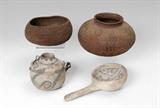 Lot 1261:  2 PIECE ANASAZI POTTERY CANTEEN & LADLE: 2 pieces to include 1) Double handle canteen pot with scrolling black over white design and triangles design lip. 4 1/4'' h. x 4 3/4''. 2) Ladle geometric designs inside bowl. 9 3/8'' l. x 4 7/8'' bowl dia.
CONDITION: 1) Area of burn on pot, chips to lip, overall wear. 2) Chips to rim, overall wear.Lot 1262:  PAIR SOUTHWEST NATIVE AMERICAN COILED BASKETS: To include 1) Diminutive bulbous form olla, band of diamond, 3 crooked lines over zigzag pattern. 5 1/4'' h. x 8''. 2) Open bowl form, no design visible. 3 1/4'' h. x 6 3/4''.
CONDITION: Both are misshapen and could use a proper cleaning, area of bleaching to number 1.