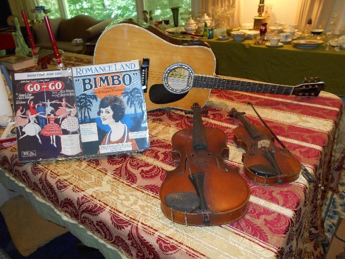 Violin, viola (both need work) and guitar, all with cases